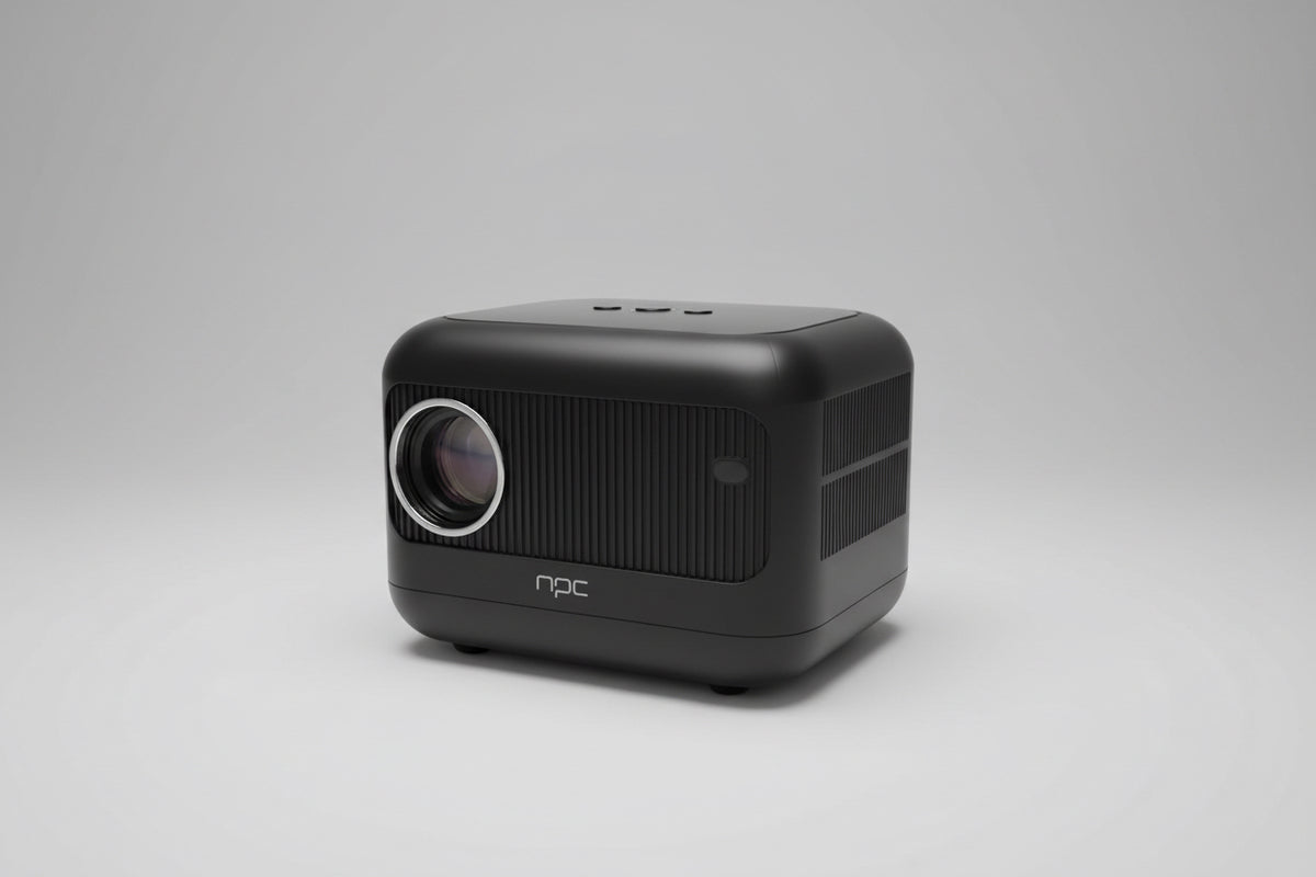 A compact NPC projector placed on a wooden surface, with a visible lens on the front and the brand name on the side.