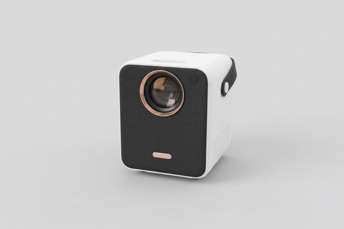 A compact BeamerX Mook 1 projector displayed on a wooden surface, featuring a white body with a black speaker grill and a lens on the front.