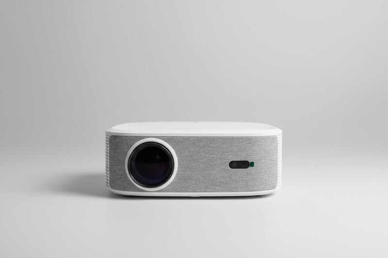 A white and gray Stinger Max Day light projector positioned on a surface, with projected light visible.